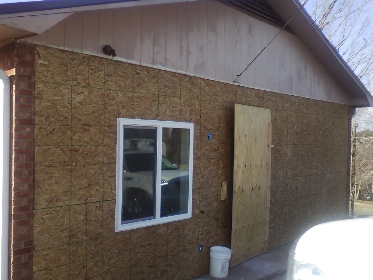 OSB sheathing on a garage addition wall before siding in Aberdeen